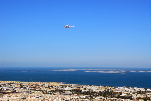 Dubai Police Helicopter with the World in the distance