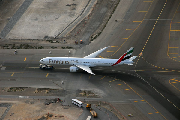 Emirates Boeing 777 under tow, DXB