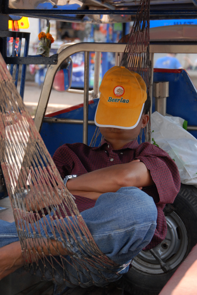 Resting tuktuk driver