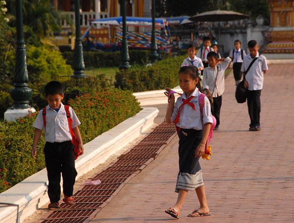 Lao pupils walking home from school