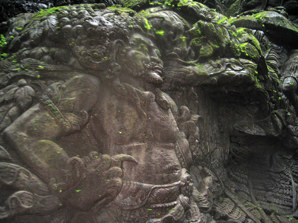 Stone carvings along the Ayung River seen from the raft