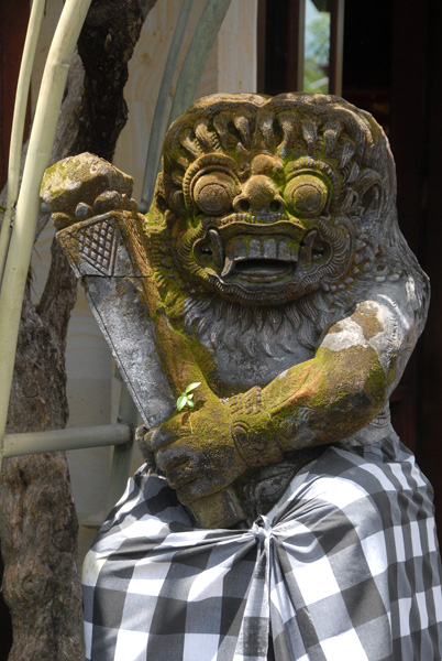 Balinese statue wearing a sarong, Tanah Lot