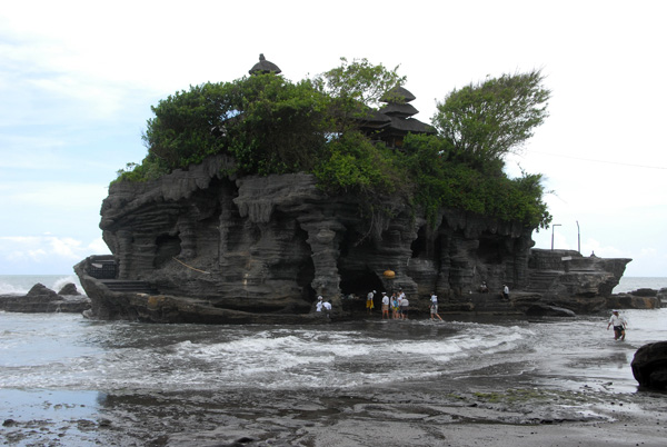 Rocky outcropping off shore with the main temple, Tanah Lot