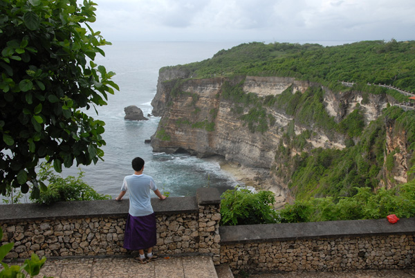 Ulu Watu sits high on a cliff overlooking the ocean at the west end of the Bukit Peninsula