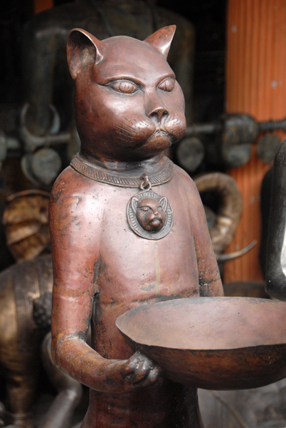 Cat with offering tray