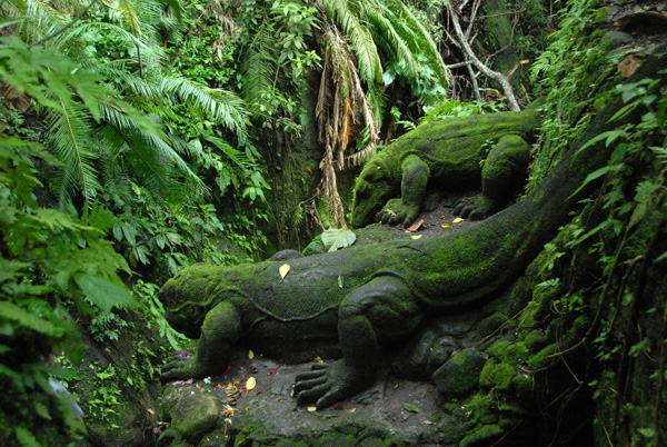 Stone carved, moss covered komodo dragon, Sacred Monkey Forest, Ubud