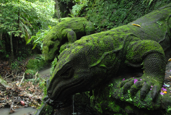 Stone carved, moss covered komodo dragon, Sacred Monkey Forest, Ubud