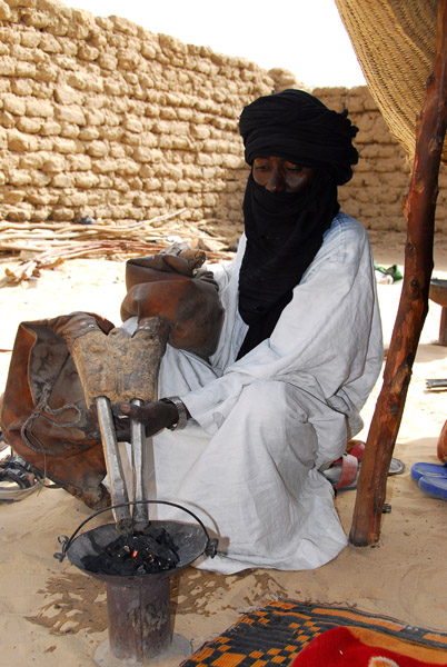 Tuareg using a bellows to heat the coals