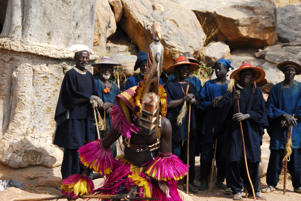 Dogon mask dancer with the older village men who perform the chorus