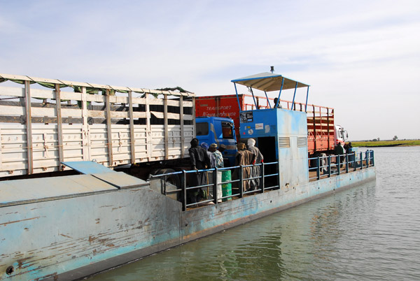 Two big trucks make a full ferry load, so we have to wait