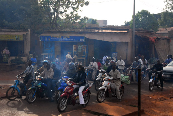 Smokey motor bike traffic, Bamako