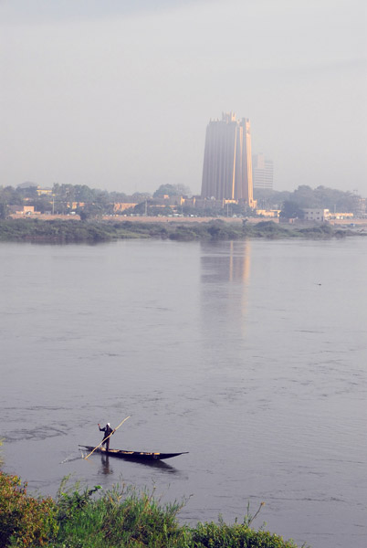 Fisherman on the Niger with central Bamako