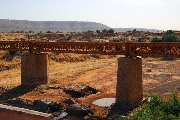Railway bridge crossing a dry river bed outside Kayes