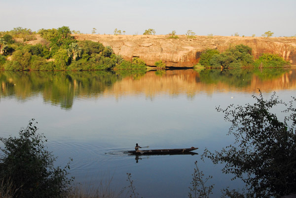 Man paddling a pirogue on the Senegal River, Félou, Mali