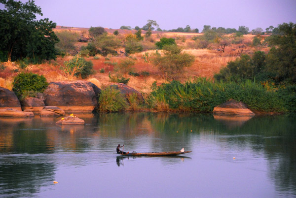 Fishing pirogue at dusk, Senegal River, Mali