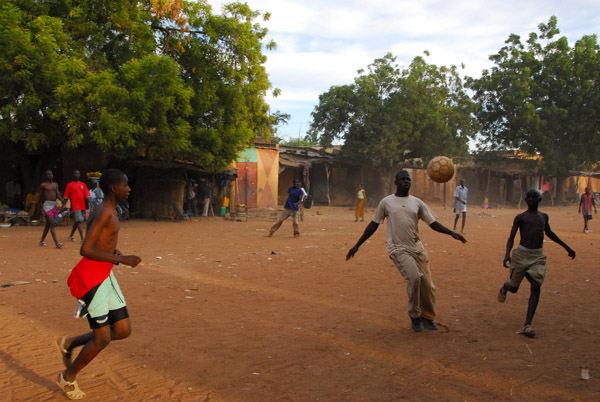 Soccer game in the center of town, Ségou, Mali