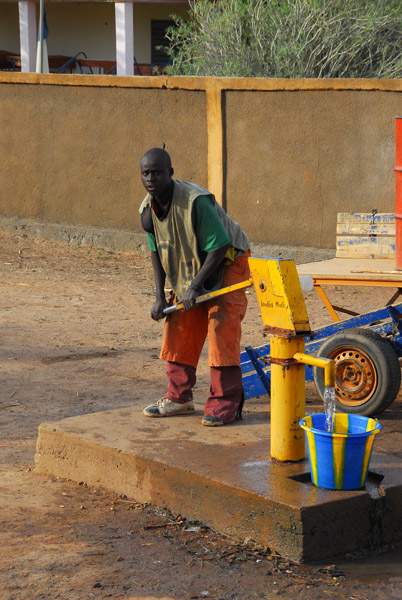 Man operating a water pump, Mali