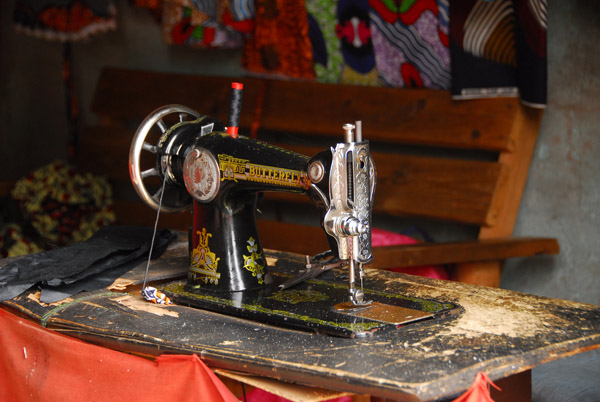 Tailor shop with foot operated Buttefly sewing machine, Diamou, Mali