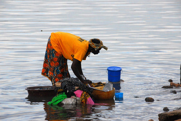 Woman doing laundry in the river, Mali