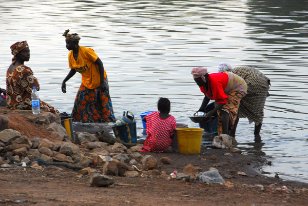 Villagers washing the breakfast dishes in the Bakoy River, Mali