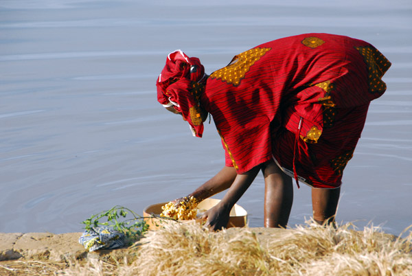 Woman rinsing millet