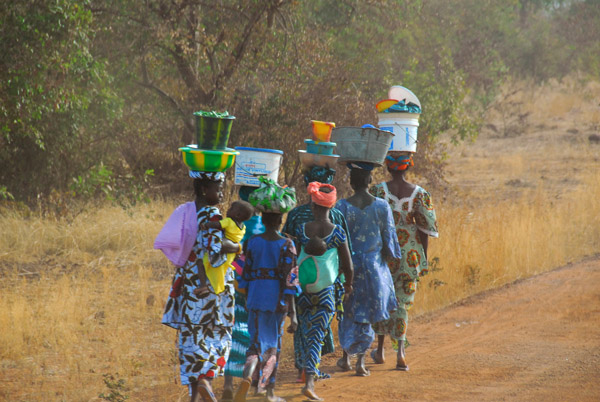 A line of women along the road
