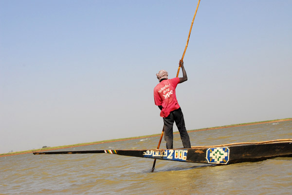 Volunteer giving hope t-shirt on a boatman
