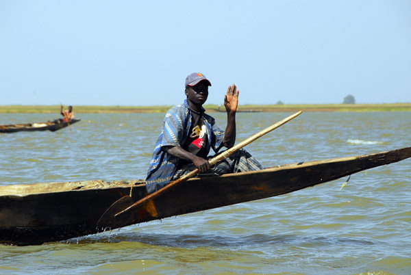 Paddler waves, Niger River, Mali
