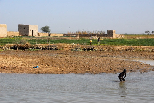 Boy bathing in the Niger River, near Kotaka
