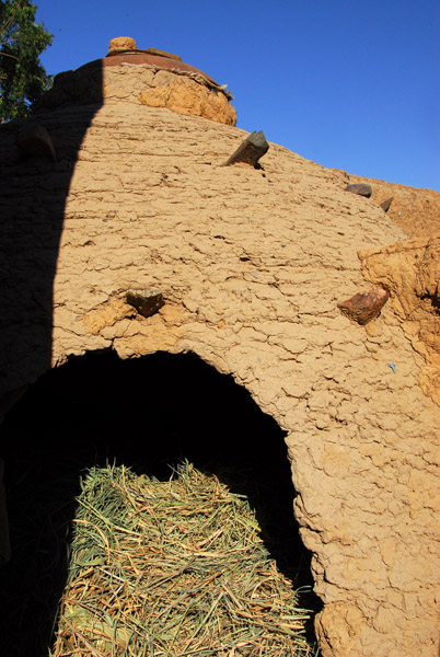 A round mudbrick structure for storing hay