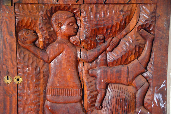 Detail of a door carving showing a beheading, Royal Palace of Abomey