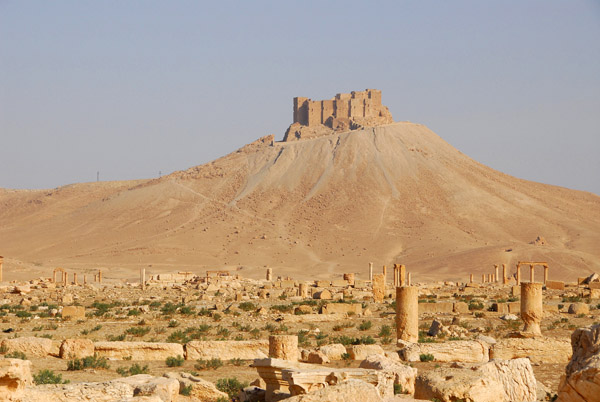 Extinct volcanic cone with the Arab Citadel rising over the ruins of Palmyra