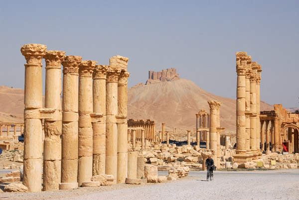 Ruins of Palmyra with Arab Citadel in the distance
