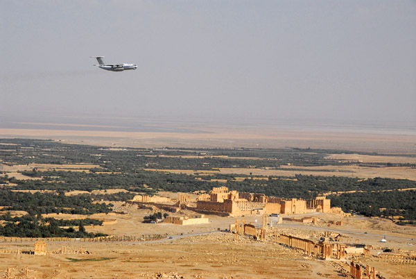 Russian-built transport flying low over the ruins of Palmyra, Syria