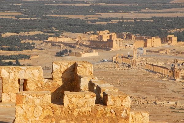 A tower of the Arab Citadel with the ruins of Ancient Palmyra