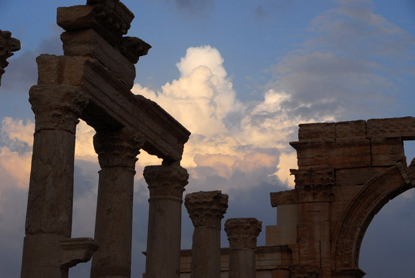 Monumental Arch with towering clouds