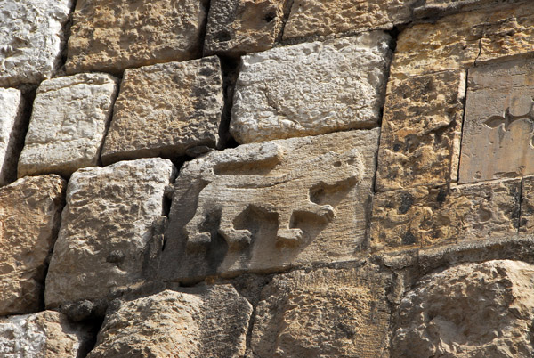 Lion carved on a stone on the northern wall of the Citadel of Damascus