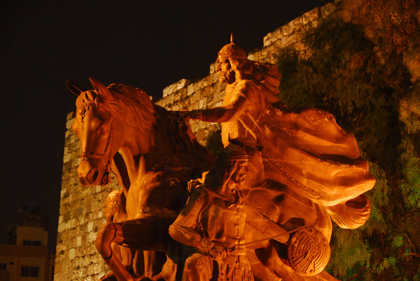 Saladin statue at night