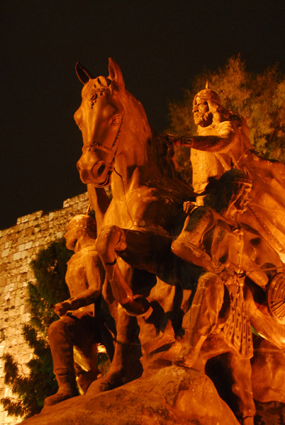 Saladin statue at night