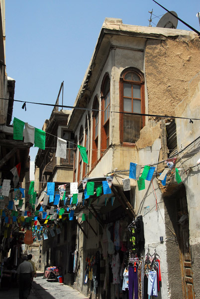 Alley in the Old City decorated with flags, Damascus