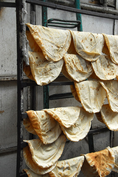 Fresh Arabic bread hung out to cool