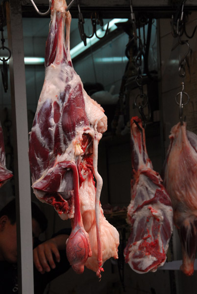 Fresh meat hanging in a butcher shop