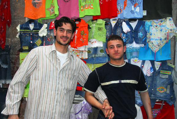 Shopkeepers in a clothing souq, Aleppo