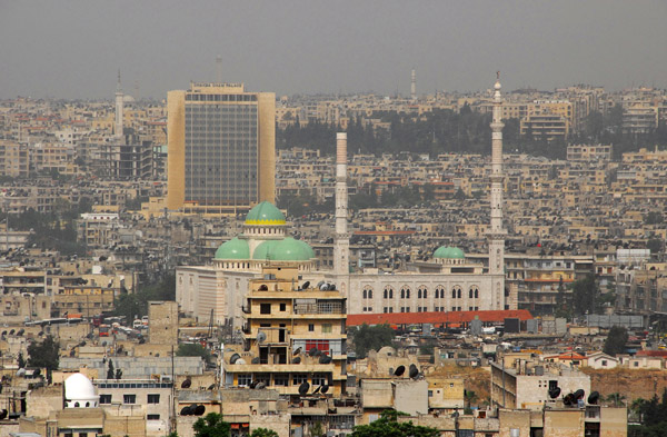 Shahba Cham Palace Hotel in the distance with an unfinsihed mosque, Aleppo