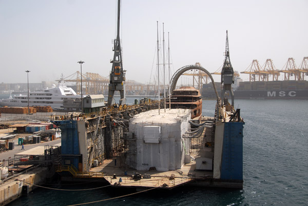 Dry dock at Jebel Ali with a 3 masted sailing ship enclosed in an air conditioned tent