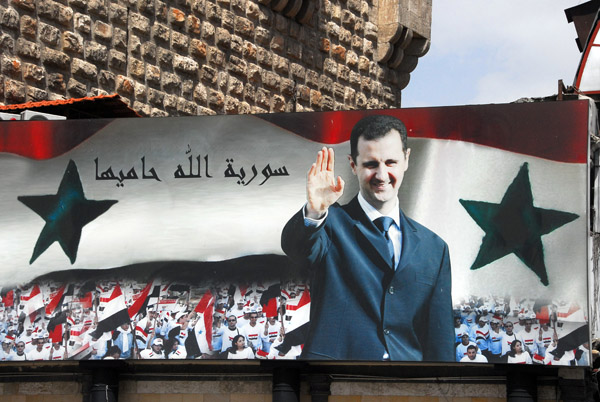 A giant billboard of Bashar greets visitors to the famous Hamidiya Souq in the Old City of Damascus