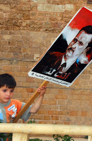Boy with a Bashar poster, Tartous