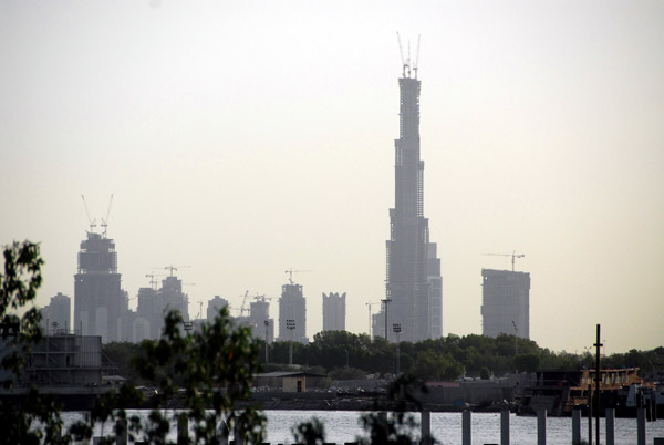 Burj Dubai seen in the distance from across the Creek at Festival City