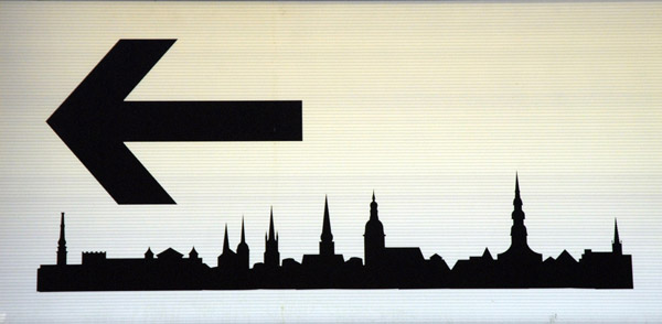 Exit sign from the bus station pointing to Old Town Riga
