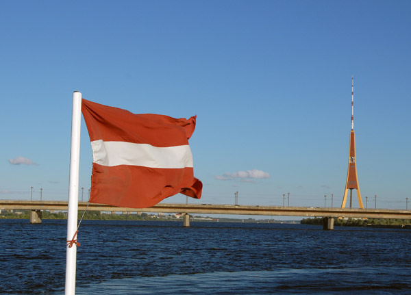 The boat's Latvian flag and the Riga TV Tower